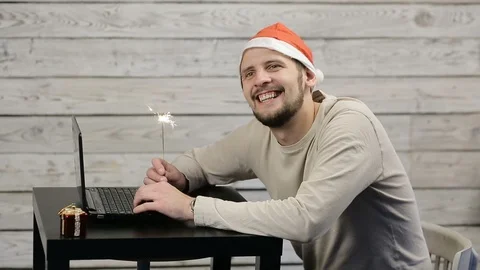 A man working at a computer in the new year Stock Footage 98730141