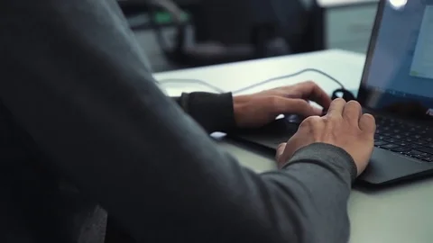 A man is working at a computer in the office Stock Footage 76000084