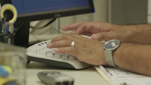 Man working on computer in office Stock Footage 83189302