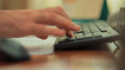 A man is working at a computer in the office Stock Footage 86849073