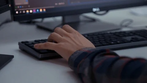 A man is working at a computer in the office Stock Footage 89063941