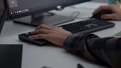 A man is working at a computer in the office Stock Footage 89063968