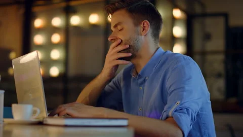 Man working on computer in office. Overworked businessman putting head on hands. Stock Footage 145403781