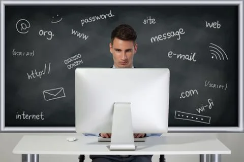 Man working at computer Photos
