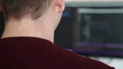 A man working at a computer programmer. Testing the program code Stock Footage 63421214