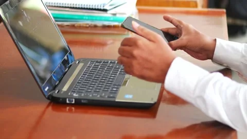 Man working on computer seated at workplace desk in office room . 4K Stock Footage 134610273
