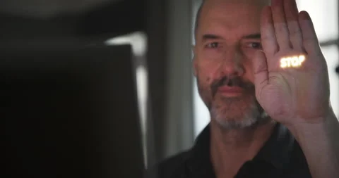 Man working on a computer showing a stop sign Vidéo 234606109