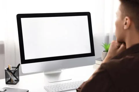 Man working on computer at white desk in office, closeup. Mockup for design Stock Photos