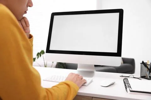Man working on computer at white desk in office, closeup. Mockup for design Stock Photos