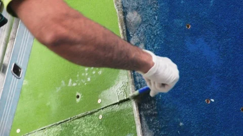Man working on the construction of a climbing wall. Climbing wall in the process Stock Footage 101176857