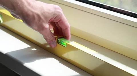 Man working with construction level Stock Footage 64621581