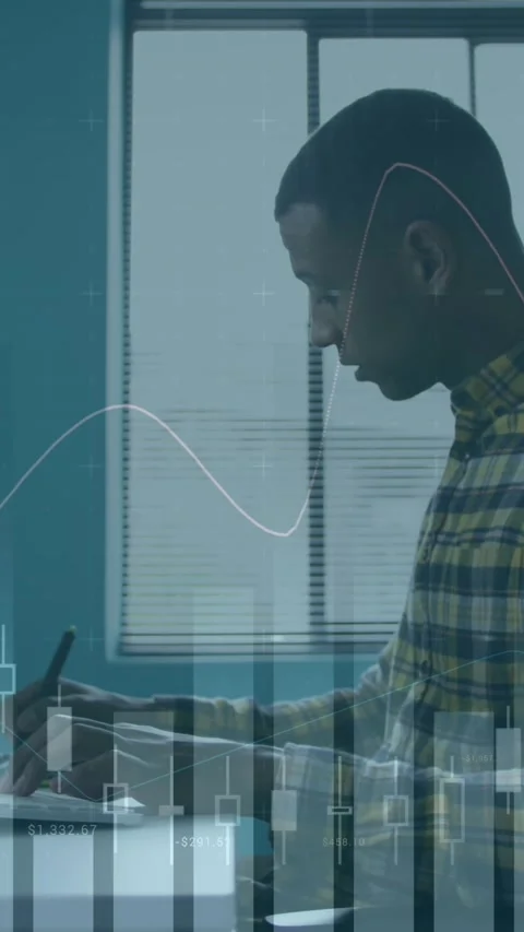 A man is working in a creative office, using a computer and graphic tablet Stock Footage 344723264