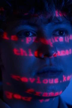 Man Working on Cybersecurity with Programming Code on Face Stock Photos