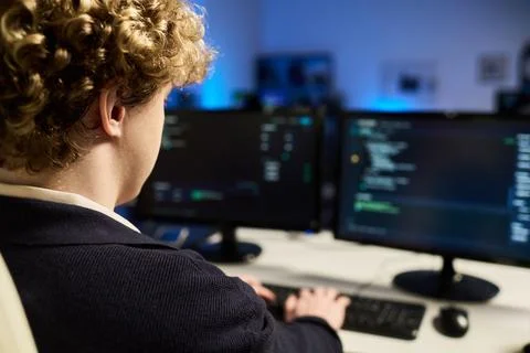 Man Working on Cybersecurity Programming with Multiple Monitors Stock Photos