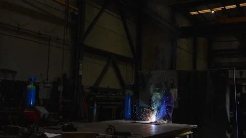 Man working in a dark factory Video stock 266747140