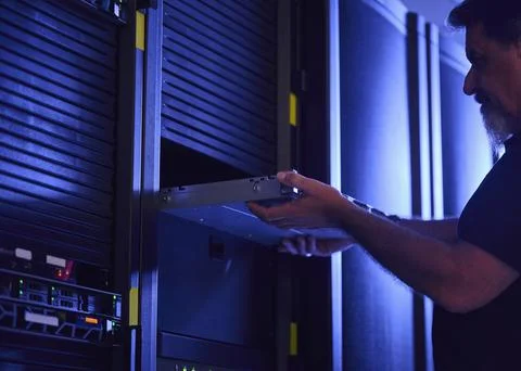 Man working in data center Stock Photos