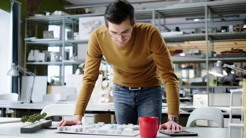 Man working in design and engineering architecture office Stock Footage 85380658