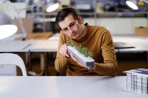 Man working in design and engineering architecture office Stock Photos
