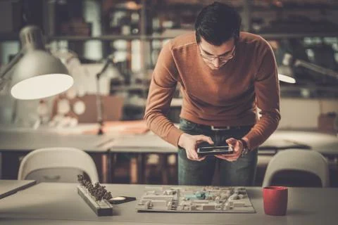 Man working in design and engineering architecture office Stock Photos
