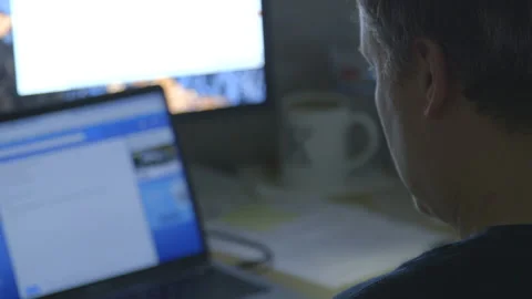 Man working at desk on laptop Stock Footage 116753728