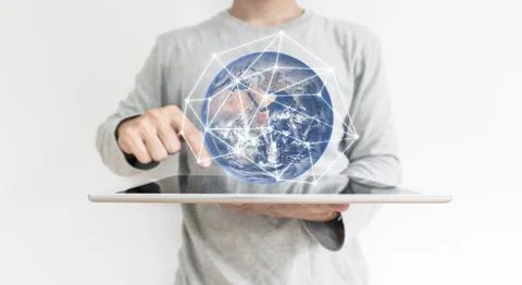 A man working on digital tablet. Element of this image are furnished by NASA Stock Photos