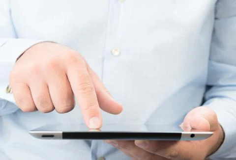 Man working on a digital tablet pc. Stock Photos
