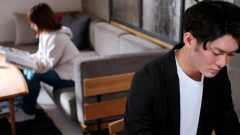 Man working at dining table Stock Footage 161871497