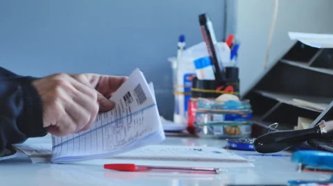 A man working with documents in a mail car Stock Footage 65365138