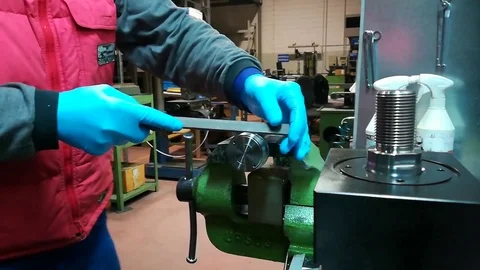 A man working at Drill press and bank clasp in a factory Stock Footage 83216730