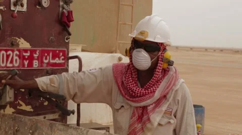 Man Working A Drilling Rig To A Oil Well Video stock 63170664