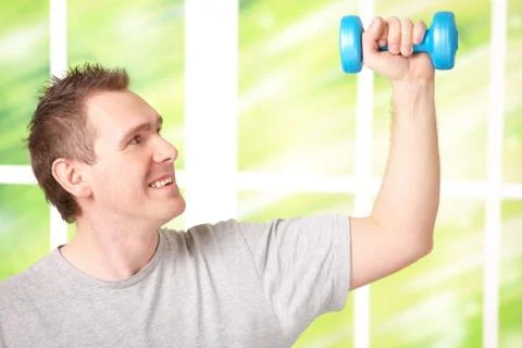Man working with dumbbells Stock Photos