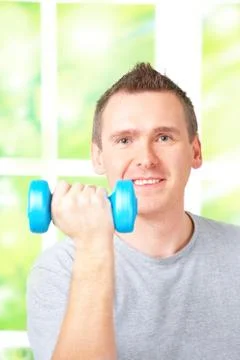 Man working with dumbbells Stock Photos