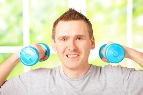 Man working with dumbbells Stock Photos