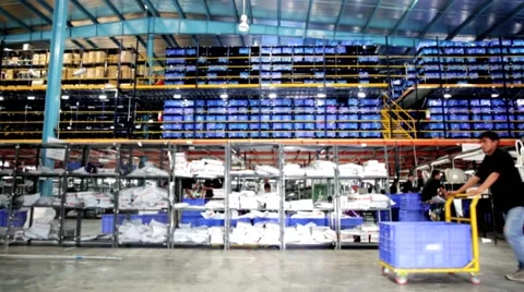 Man Working at an E-commerce WareHouse Pulling a Trolley Pallet Stock Footage