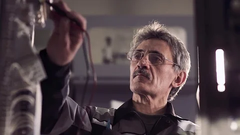 Man working with electric tools. Stockbeeldmateriaal 77105716