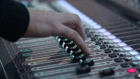 Man working at an event. audio mixer knobs being pulled. hand presses the keys 스톡 동영상 76925618