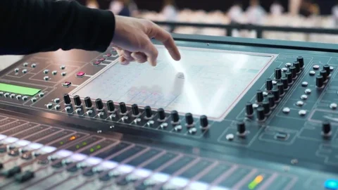 Man working at an event. audio mixer knobs being pulled. hand presses the keys 스톡 동영상 76926999
