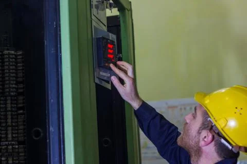Man working in a factory, engineer at work 库存照片