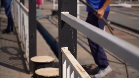 Man working on a ferry boat, close-up of the railing and bollards Stock Footage 278316094