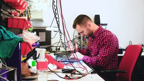 Man working on fixing a computer Stock Footage 104553034