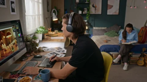 Man Working as Graphic Designer on Computer Using Graphics Tablet Vídeo Stock 341947787