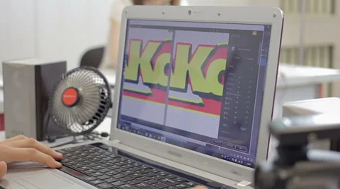 Man working in the graphics editor on his computer Stock Footage 61798335