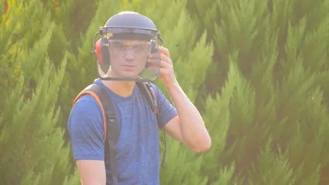 Man working with grass trimmer Stock Footage 80282174