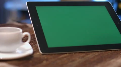 Man working with a green screen on a tablet computer. Stock Footage 62851533