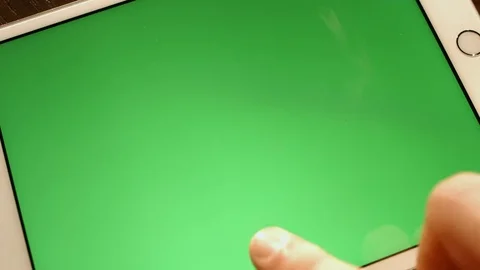 Man working with a green screen on a tablet computer the camera is in motion. Stock Footage 72207480