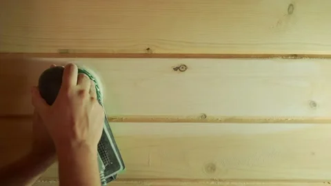 A man working with a grinding machine at the construction site. Male carpenter Stock Footage 162447463