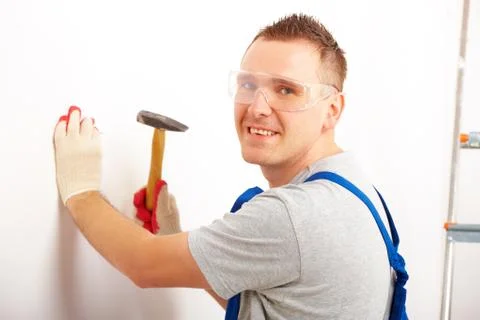 Man working with hammer Stock Photos
