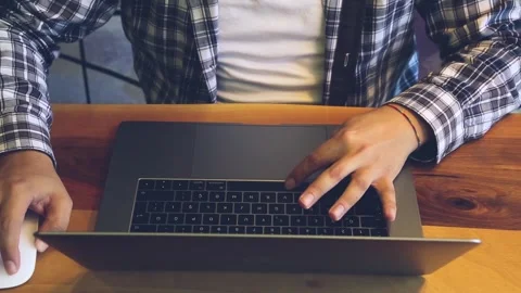 Man working on his computer in cafe Stock Footage 246628099