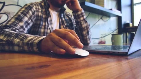 Man working on his computer in cafe Stock Footage 246628105