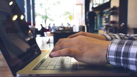 Man working on his computer in cafe Stock Footage 246628120